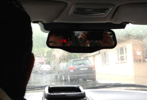 Taximeter on rear-view mirror displaying 11.36